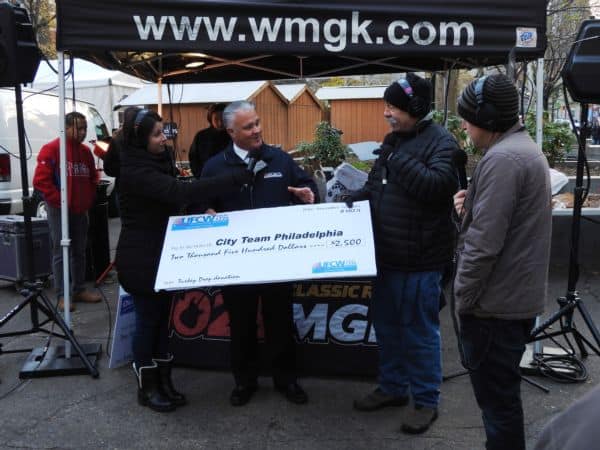 President Young surprised radio host John DeBella and his crew with an added $1,500 donation to the cause.